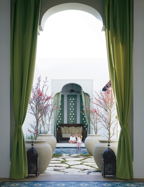 55-Charming-Morocco-Style-Patio-Designs-with-white-green-wall-curtain-big-pots-sofa-fan-stone-floor-and-outdoor-view